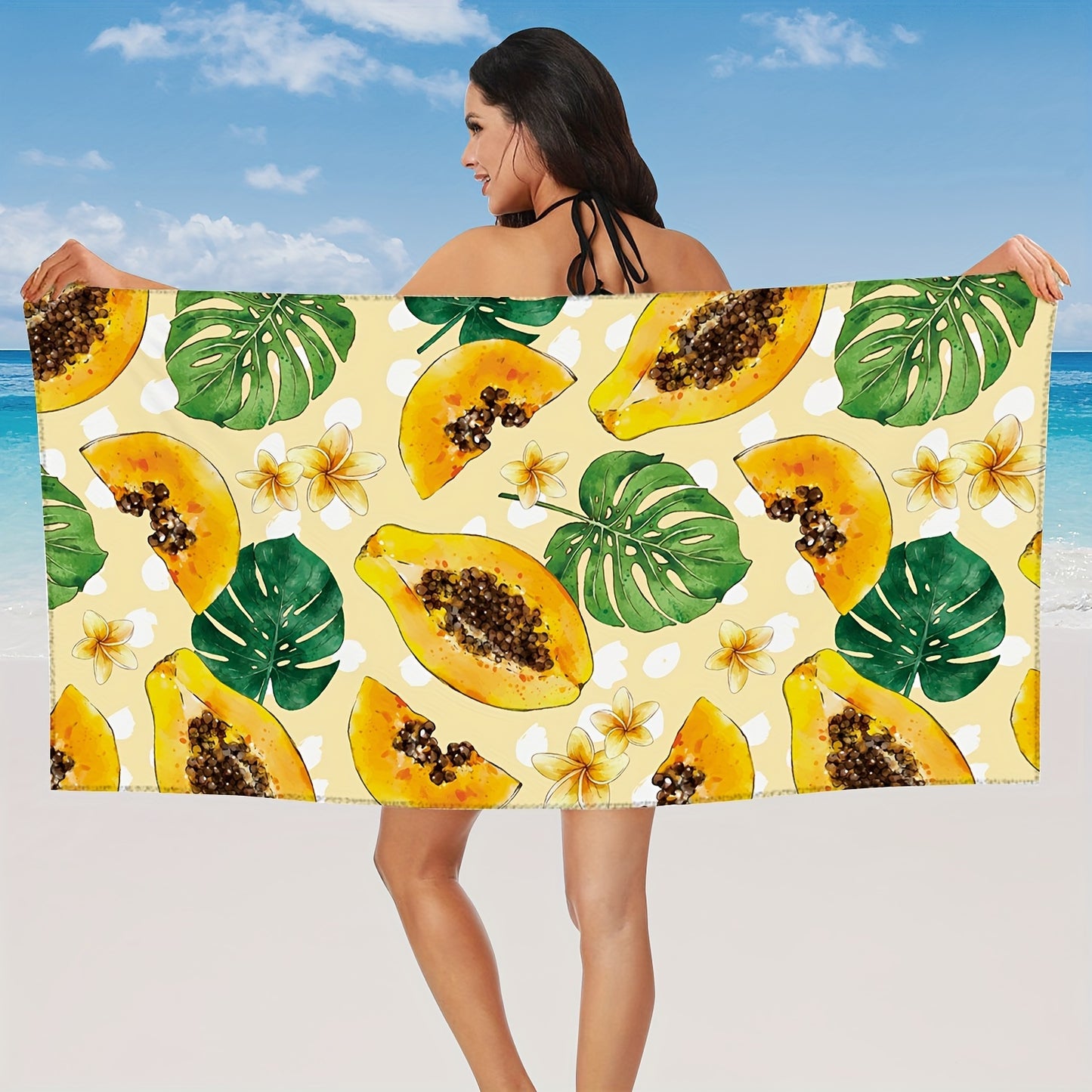 Tropical Papaya or pawpaw with tropical leaf and frangipani patterns on beach bath towel